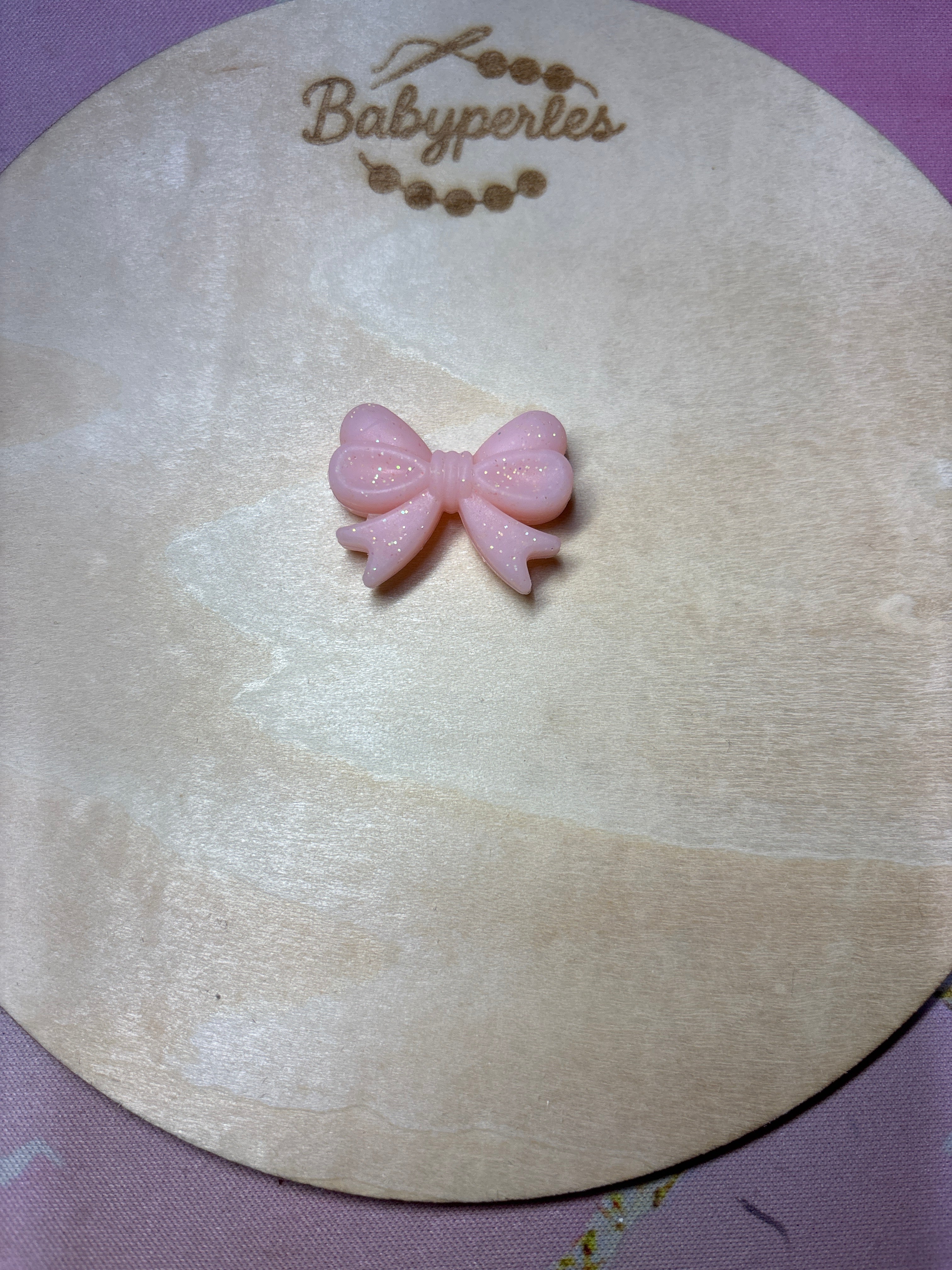 Noeud de papillon pailletée rose corail