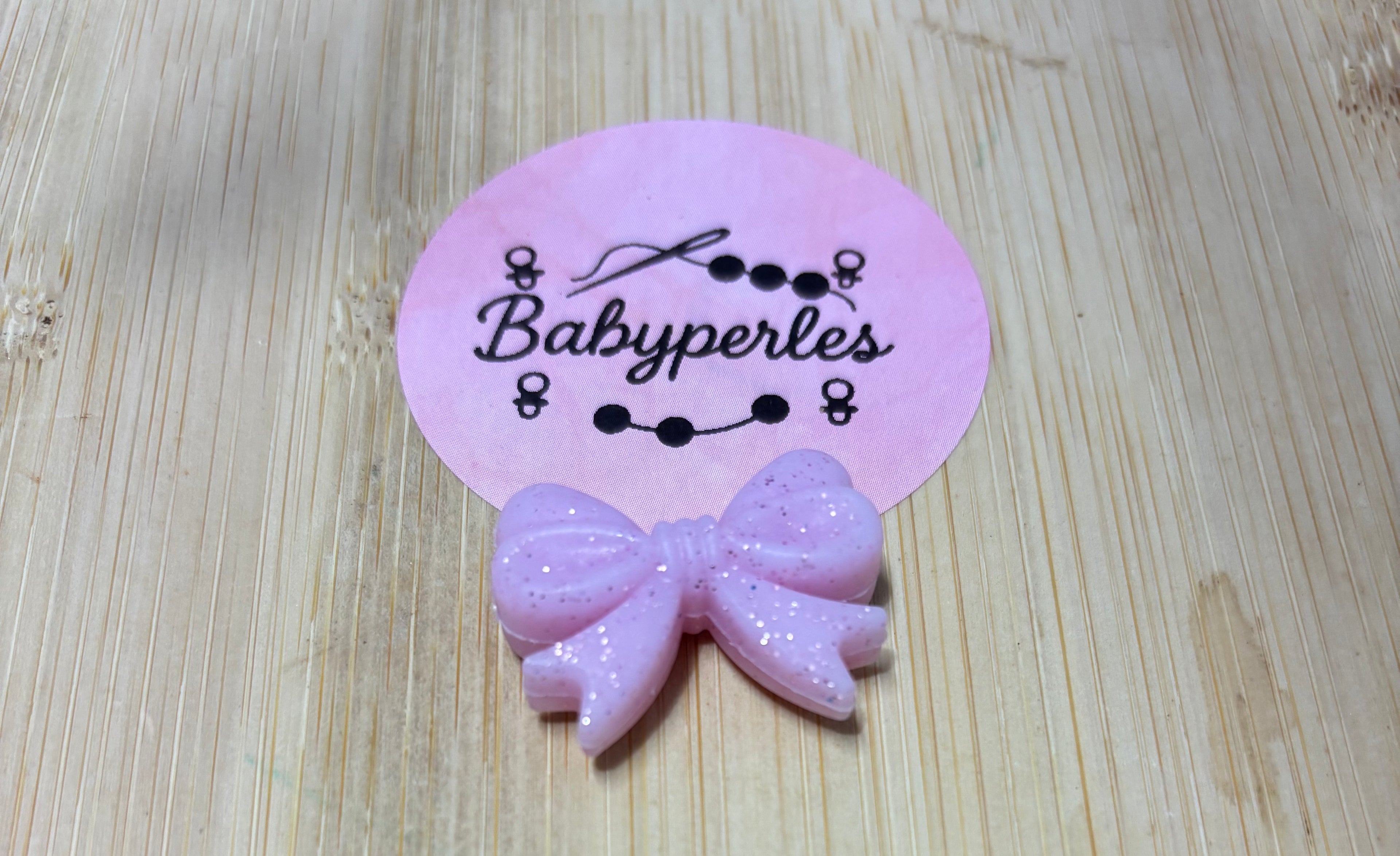 Noeud de papillon pailletée rose clair