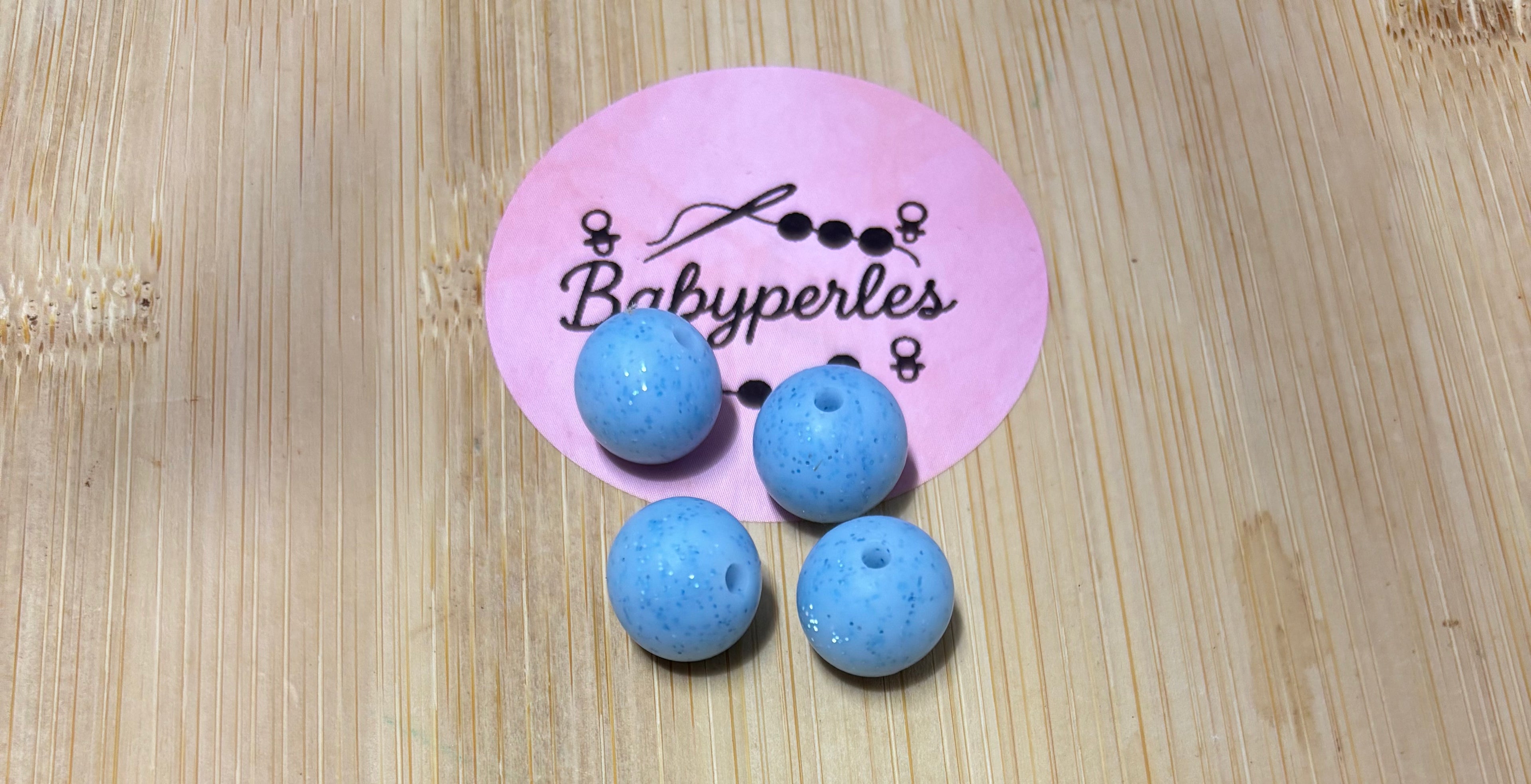 Perles 12 mm bleu clair pailletée