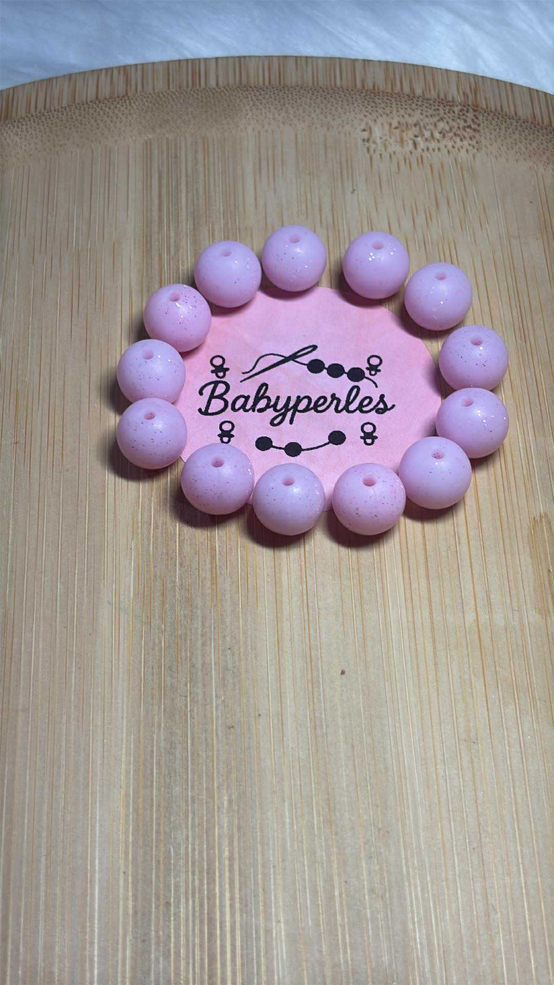 Perle ronde 12 mm rose clair pailleté